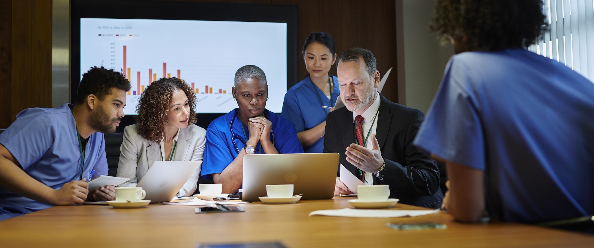 People sitting at a conference table.