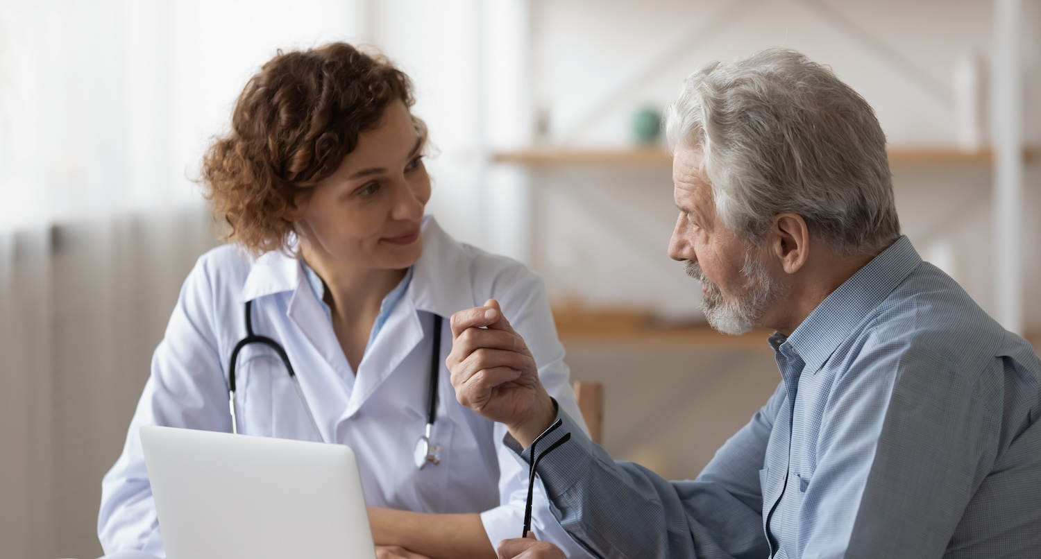 A health care provider and a patient talking.